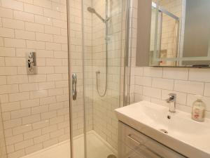 a bathroom with a shower and a sink at Rectory Cottage in Oswestry +14 photos
