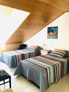 Posteľ alebo postele v izbe v ubytovaní Maison Blanche