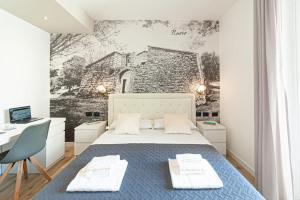 A bed or beds in a room at Eleonore Elegant Rooms