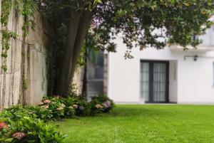Сад в Le Petit Boutique Hotel