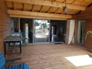 a patio with sliding glass doors on a house at COSA SARA in Niort