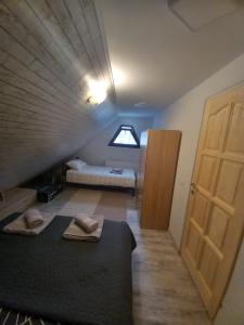 a room with a staircase with a bed and a door at Happy Guests Residence in Sibiu
