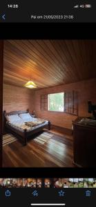 a large room with a bed and a window at toda paz do universo in Nova Friburgo