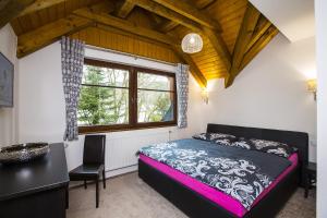 Postel nebo postele na pokoji v ubytování Apartmány Slunce
