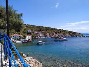 a group of boats docked in a body of water at Aglaia's traditional house in Ayía Kiriakí