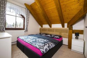 Postel nebo postele na pokoji v ubytování Apartmány Slunce