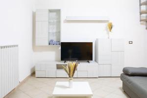 TV a/nebo společenská místnost v ubytování La Dimora di Anna - tra le Vallate Alpine