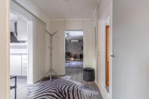 a zebraebra rug on the floor of a room at Kuukkeli Ivalo Arctic House in Ivalo