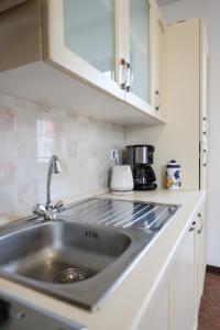 A kitchen or kitchenette at Villa Ena with Pool & Jacuzzi