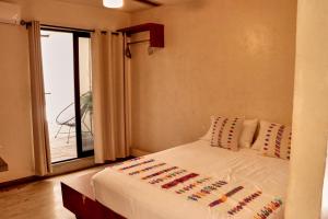Postel nebo postele na pokoji v ubytování Casa Nomada Tuxtla Hotel - Hostal