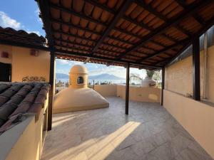 a room with a bed on the roof of a building at Casa Mi Pueblito in Ajijic