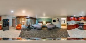 a large room with two beds and a kitchen at Quality Inn Fairfield Napa Valley Area in Fairfield