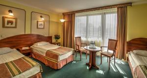 Posteľ alebo postele v izbe v ubytovaní Hotel Wersal