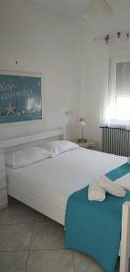Ένα ή περισσότερα κρεβάτια σε δωμάτιο στο Villa Rea Di Mare
