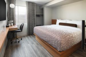 Un pat sau paturi într-o cameră la Hotel Keen