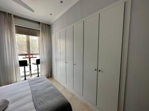 Posteľ alebo postele v izbe v ubytovaní Reinapart Patacona Beach 36