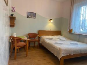 Ένα ή περισσότερα κρεβάτια σε δωμάτιο στο Willa Nadmorska +45 φωτογραφίες