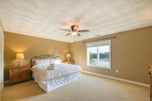 a bedroom with a bed and a ceiling fan at Paradise at Sunset Cove in Moneta