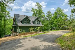 a green house on the side of a road at Emerald Cove in Moneta