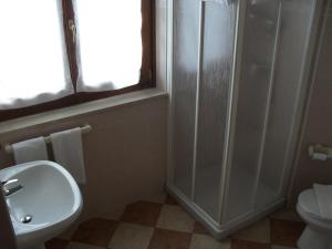 a bathroom with a shower and a sink and a toilet at Agriturismo Ca' Licante in Bardolino +14 photos