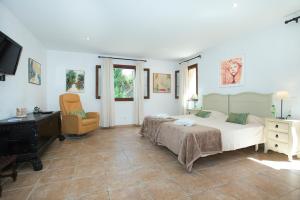 A bed or beds in a room at Owl Booking Villa Siquier - Luxury Retreat with Mountain Views