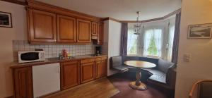 Kuchyň nebo kuchyňský kout v ubytování La Perle Apartments