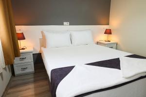 Canada Hotel & Bungalows客房内的一张或多张床位