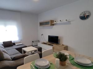 a living room with a couch and a table at Casa Jesùs in Ontinyent