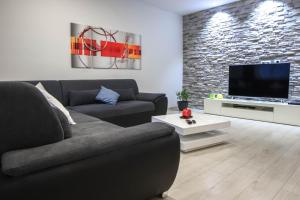 TV/trung tâm giải trí tại kuća za stanovanje ,cijeli prostor