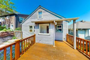 a home with a wooden deck with a house at Wallingford Heights in Seattle