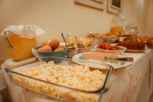 a table topped with dishes of food on a counter at Archontiko Eleni Hotel in Andros
