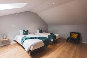 Katil atau katil-katil dalam bilik di Nascer Do Sol Retreat Villa