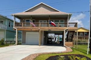 a house with two flags on a deck at Sweet Studio Suite in Rockport