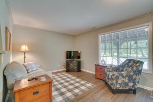 a living room with a couch and a chair at Charming Crossville Apt Less Than 10 Mi to Golf Courses! in Crossville