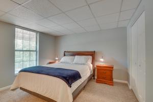 a bedroom with a large bed and a window at Charming Crossville Apt Less Than 10 Mi to Golf Courses! in Crossville