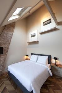 Ένα ή περισσότερα κρεβάτια σε δωμάτιο στο Hotel Sleep-Inn Box 5