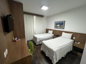 Cama ou camas em um quarto em Nobile Hotel Belo Horizonte