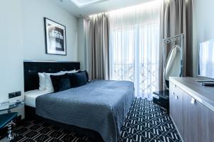 Posteľ alebo postele v izbe v ubytovaní Hotel Atelia