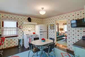 a kitchen and dining room with a table and chairs at Retro-Style Home in Ruston Walkable Location! 