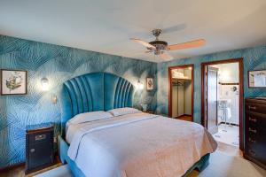 a bedroom with a bed and a ceiling fan at Retro-Style Home in Ruston Walkable Location! 