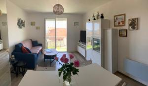 Televízia a/alebo spoločenská miestnosť v ubytovaní Appartement 2P à 1 min de la mer
