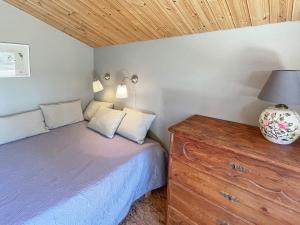 Säng eller sängar i ett rum på Holiday home MARIEFRED VIII