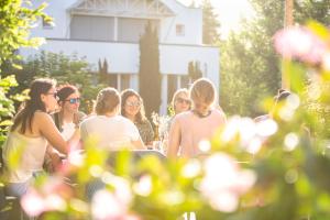 a group of women standing around in a garden at Flem Mountain Lodge in Flims