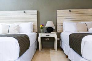 Postel nebo postele na pokoji v ubytování Hotel Siesta Holbox