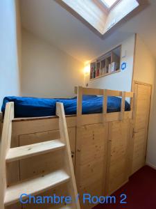 a bedroom with a bunk bed with a blue mattress at Le Petit Cham in Chamonix-Mont-Blanc