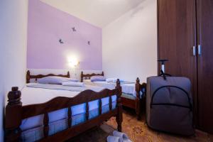 Postel nebo postele na pokoji v ubytování Silver Beach Apartments Vis