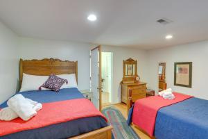 a bedroom with two beds with red and blue at Mtn Views and Epic Sunsets Private Weaverville Home in Weaverville