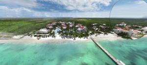 an aerial view of a resort on a beach at Charming Sea Side Ocean Front Condo in Puerto Morelos