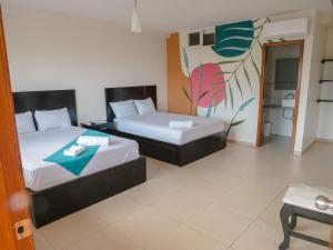 Postel nebo postele na pokoji v ubytování Margaritas Palace Hotel + 37 fotografií