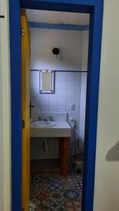 a bathroom with a sink and a mirror at Pousada Ora Pro Nobis in Catas Altas